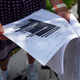 Journalists gather outside the Paul S. Rogers Federal Building and U.S. Courthouse in downtown West Palm Beach, Fla., to read a heavily blackout document released by The Justice Department Friday, Aug. 26, 2022.